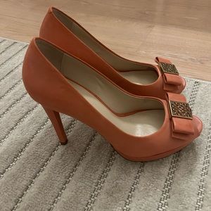 Coach heels size 8. Color is a coral pink. Have been used before.